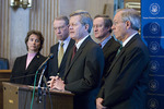 Max Baucus at press conference by Creator unknown