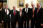 Max Baucus, Barack Obama and others at Affordable Care Act signing ceremony by Creator unknown