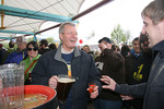 Max Baucus pouring beer at brew fest by Creator unknown