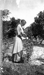 Eva in a garden by Mary Helterline Flynn